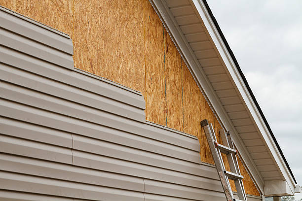 Professional Siding technician working in Arden, NC